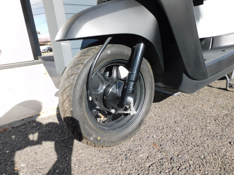 中古車 ホンダ タクト(TACT) ベーシック ホワイト フロントホイール左 2025年12月16日